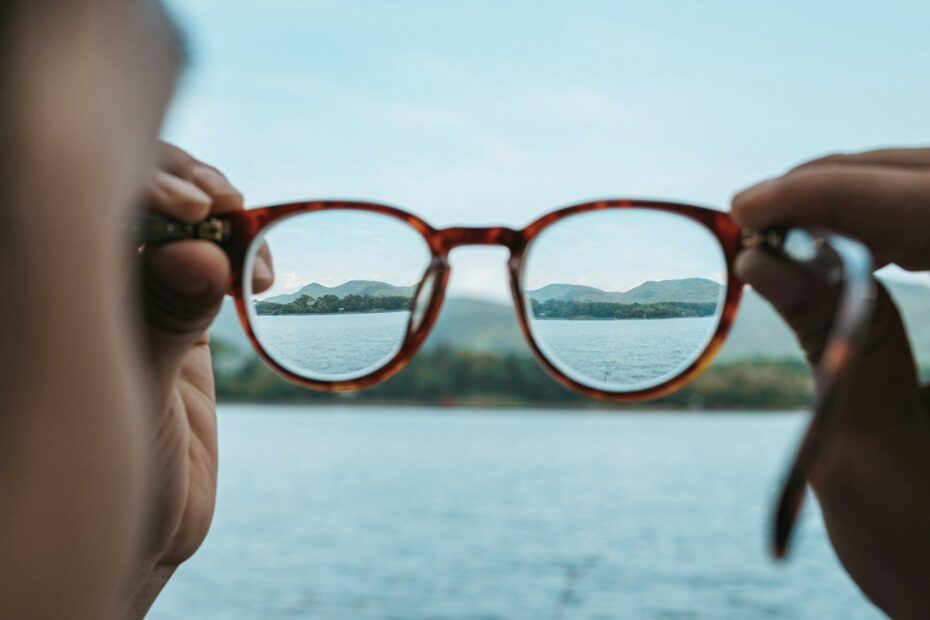 A woman looking through a pair of glasses